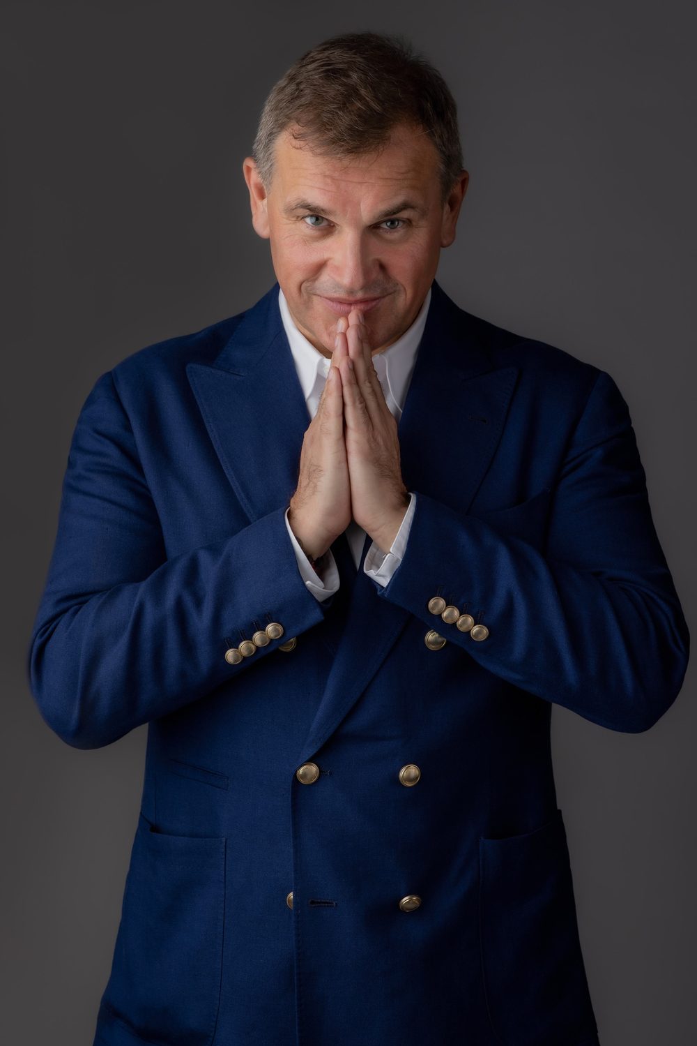 Alex Zagrebelny in a navy double-breasted jacket